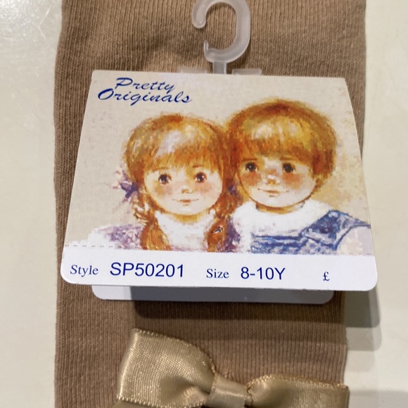 Girls cotton tights Size 8 run small (5-7) bow on both sides brand new tan - Picture 7 of 7